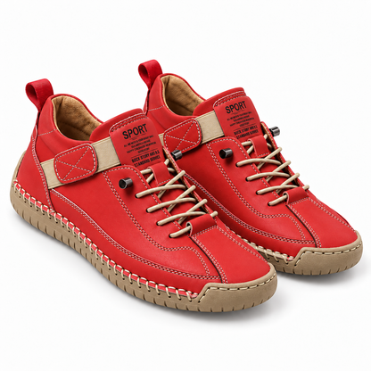 Mirabelle, zapatillas rojas con suela clara: par visto en tres cuartos.